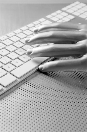 Futuristic silver gray hand and computer keyboard Photographie de stock - Aubaine LD & Abonnement, Code: 400-05240032