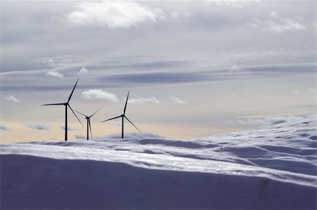 aerogenerator electric windmills snow mountain blurred foreground Stock Photo - Budget Royalty-Free & Subscription, Code: 400-05240192