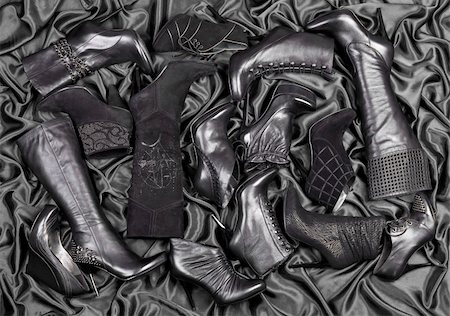 simsearch:400-07218273,k - Female black shoes and boots placed on black satin. Studio shot. Stock Photo - Budget Royalty-Free & Subscription, Code: 400-05240990