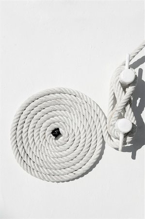 simsearch:400-04793526,k - spiral white sea nautical rope on sailboat boat mooring Stock Photo - Budget Royalty-Free & Subscription, Code: 400-05254294