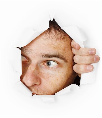 simsearch:400-04748544,k - The man startled looks through a hole Stock Photo - Budget Royalty-Free & Subscription, Code: 400-05257381