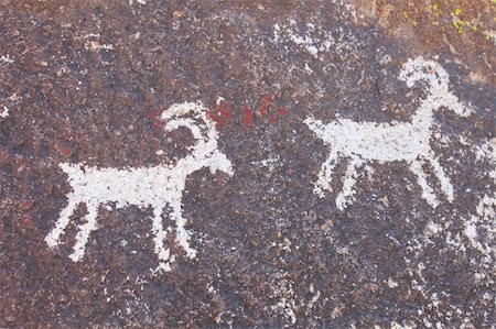 Ancient Petroglyphs on a rock wall at Grapevine Canyon - Nevada. Stock Photo - Budget Royalty-Free & Subscription, Code: 400-05257581