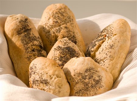 simsearch:614-06169178,k - Basket of fresh baked bread in the first light of the sun. Stock Photo - Budget Royalty-Free & Subscription, Code: 400-05253030