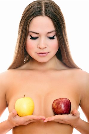 Beautiful naked woman with the apples. Isolated on a white background. Photographie de stock - Aubaine LD & Abonnement, Code: 400-05268862
