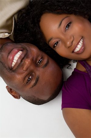simsearch:400-04739802,k - Smiling black couple laying down Stock Photo - Budget Royalty-Free & Subscription, Code: 400-05269428