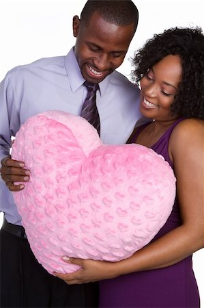 simsearch:400-04739802,k - Romantic couple holding heart pillow Stock Photo - Budget Royalty-Free & Subscription, Code: 400-05269429