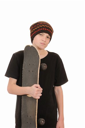 The teenager with a skateboard and in a hat isolated on white background Stock Photo - Budget Royalty-Free & Subscription, Code: 400-05260723