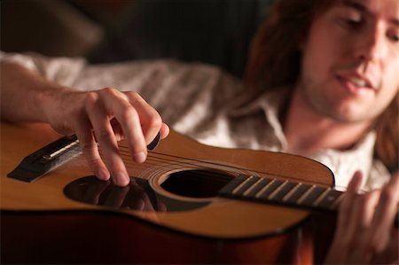 simsearch:400-04863651,k - Young Musician Plays His Accustic Guitar under Dramatic Lighting. Stock Photo - Budget Royalty-Free & Subscription, Code: 400-05262055