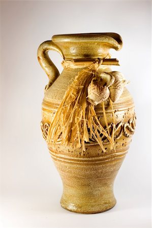 Pottery pitcher antique ,in brown background. Foto de stock - Super Valor sin royalties y Suscripción, Código: 400-05277421