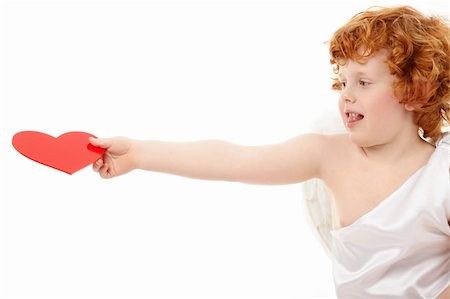 Small happy cupid holds heart on an outstretched arm, isolated Stock Photo - Budget Royalty-Free & Subscription, Code: 400-05279767