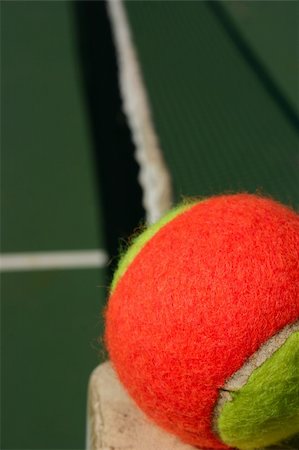 simsearch:400-04833689,k - Yellow-red balls on a green tennis court Stock Photo - Budget Royalty-Free & Subscription, Code: 400-05272528