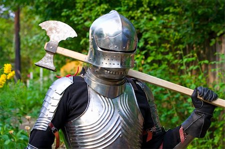 silver protection suit - knight in shining armor on a green background Stock Photo - Budget Royalty-Free & Subscription, Code: 400-05285834