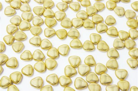 simsearch:400-05368603,k - Heart-shaped Gold Chocolate Lollies on White Background Stock Photo - Budget Royalty-Free & Subscription, Code: 400-05289909