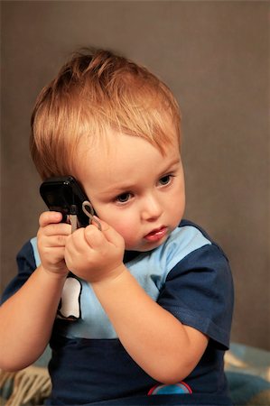 simsearch:400-04594888,k - Photo of small boy with phone in studio Stock Photo - Budget Royalty-Free & Subscription, Code: 400-05280503