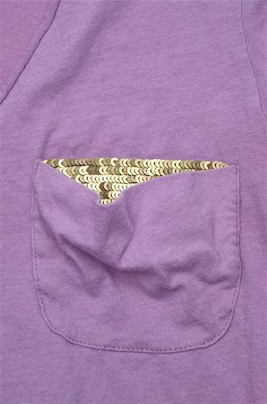 simsearch:400-04263617,k - Tee Shirt Pocket with Gold Interior Clothing Image. Photographie de stock - Aubaine LD & Abonnement, Code: 400-05281550