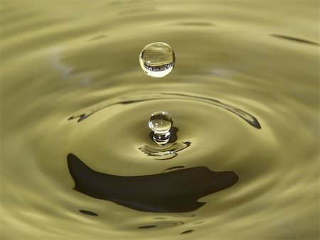 simsearch:400-04822803,k - macro shot of a water drop onto green water Stock Photo - Budget Royalty-Free & Subscription, Code: 400-05282643