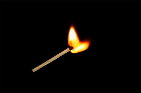 Light a match on a black background Stock Photo - Budget Royalty-Free & Subscription, Code: 400-05294590