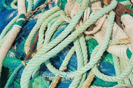 simsearch:6118-08910527,k - A stack of colourful fishing nets and ropes Foto de stock - Super Valor sin royalties y Suscripción, Código: 400-05294750