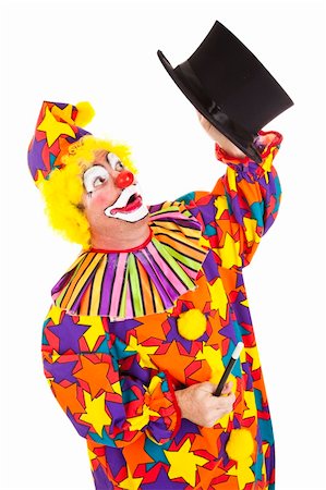 simsearch:700-01185219,k - Confused clown looking for the rabbit he lost in a magic top hat.  Isolated on white. Stock Photo - Budget Royalty-Free & Subscription, Code: 400-05295720