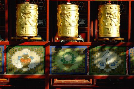 Three golden prayer wheels in the sunlight,Tibet Stock Photo - Budget Royalty-Free & Subscription, Code: 400-05297167