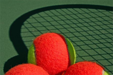 simsearch:400-04833689,k - Yellow-red balls on a green tennis court Stock Photo - Budget Royalty-Free & Subscription, Code: 400-05297269