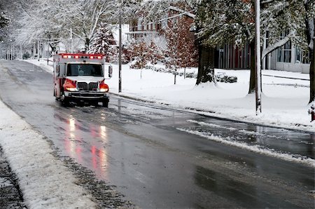 simsearch:700-00090429,k - An ambulance driving to an emergency on a snow day Stock Photo - Budget Royalty-Free & Subscription, Code: 400-05297683