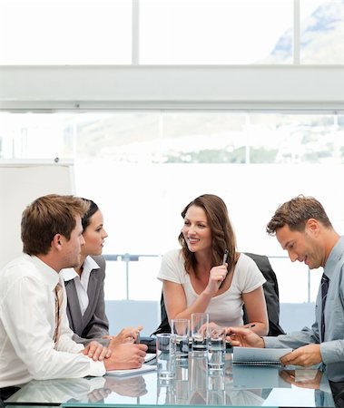 simsearch:400-05746962,k - Glad businesswoman talking to her team during a meeting Stock Photo - Budget Royalty-Free & Subscription, Code: 400-05297954