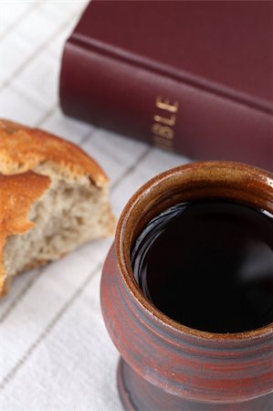 Chalice with red wine, bread and Holy Bible on a tablecloth Stock Photo - Budget Royalty-Free & Subscription, Code: 400-05290768