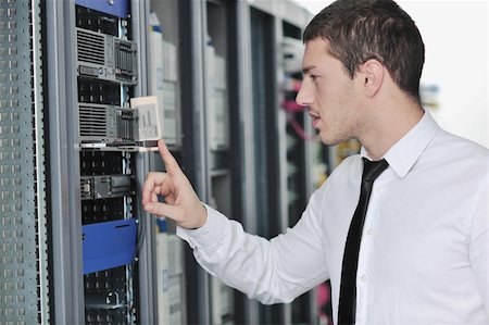 simsearch:400-05291415,k - young handsome business man  engeneer in datacenter server room Stock Photo - Budget Royalty-Free & Subscription, Code: 400-05291406