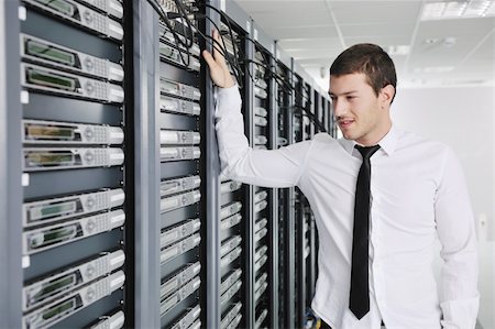 simsearch:400-05881495,k - young handsome business man  engeneer in datacenter server room Stock Photo - Budget Royalty-Free & Subscription, Code: 400-05291402