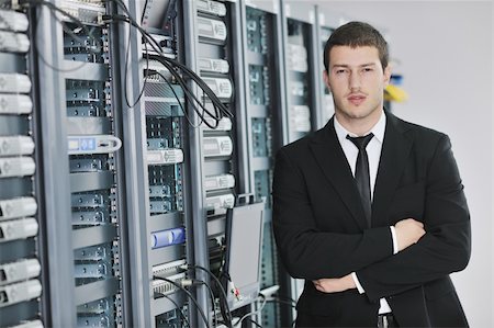 simsearch:400-05291415,k - young handsome business man  engeneer in datacenter server room Stock Photo - Budget Royalty-Free & Subscription, Code: 400-05291417