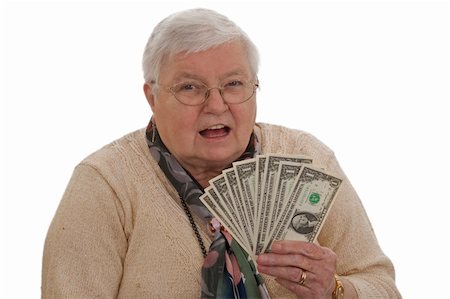 Old woman holding Dollars and laughing - isolated on white Stock Photo - Budget Royalty-Free & Subscription, Code: 400-05292323