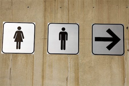 public bathrooms men - Couples this way - restroom signs on concrete wall Stock Photo - Budget Royalty-Free & Subscription, Code: 400-05292346