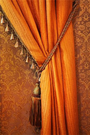 red and gold fabric for curtains - curtain with an ornament in the modern  apartment Stock Photo - Budget Royalty-Free & Subscription, Code: 400-05305807
