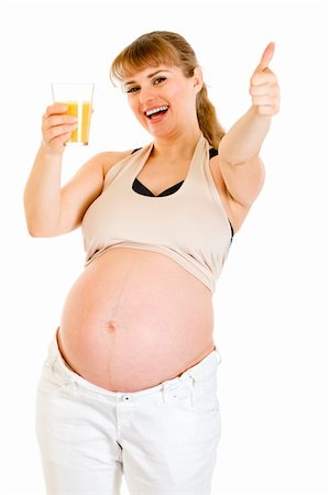 simsearch:400-04817039,k - Smiling pregnant woman holding glass of juice and showing  thumbs up gesture isolated on white Stock Photo - Budget Royalty-Free & Subscription, Code: 400-05305909