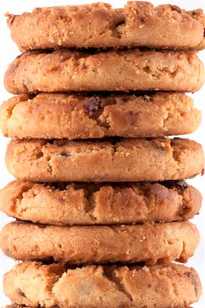fat distress - Close up of a tower of freshly baked delicious chocolate chip cookies just out of the oven. A lot of Calories but it taste so good. White background Stock Photo - Budget Royalty-Free & Subscription, Code: 400-05306751