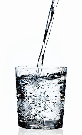 simsearch:400-05359029,k - Water pouring in a glass isolated  white background Photographie de stock - Aubaine LD & Abonnement, Code: 400-05306885