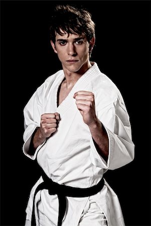 simsearch:400-04347301,k - Karate male fighter young high contrast on black background Photographie de stock - Aubaine LD & Abonnement, Code: 400-05308174