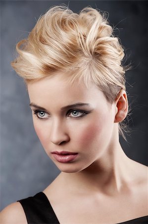 beauty portrait of young blond girl with fashion hair style and make up on dark background Stock Photo - Budget Royalty-Free & Subscription, Code: 400-05308753