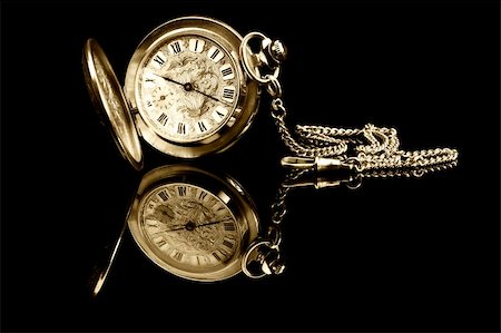 pocket watch - old pocket watch on black background with reflection Stock Photo - Budget Royalty-Free & Subscription, Code: 400-05309375