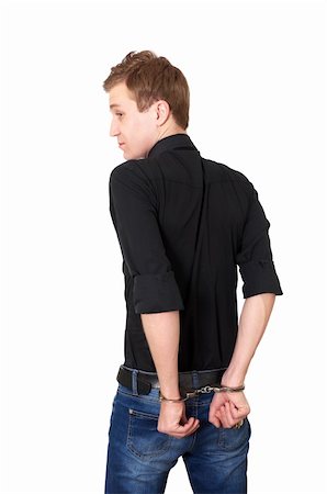 Man in handcuffs isolated on white background Stock Photo - Budget Royalty-Free & Subscription, Code: 400-05309439