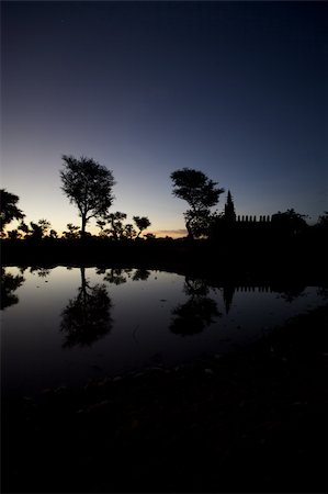 simsearch:400-06099430,k - Early in the morning, sunrise in the Dogons Land on the lake and view on the mosque of the village. Stock Photo - Budget Royalty-Free & Subscription, Code: 400-05309695