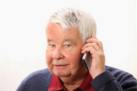 phone one person adult smile elderly - A portrait of a senior man talking on the phone against white background Stock Photo - Budget Royalty-Free & Subscription, Code: 400-05300961