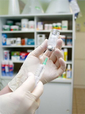 hypodermic syringe that is being filled with vaccine in clinic Stock Photo - Budget Royalty-Free & Subscription, Code: 400-05302025