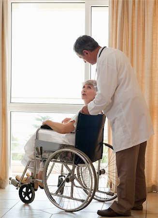 Doctor with his patient looking out the window Stock Photo - Budget Royalty-Free & Subscription, Code: 400-05314274