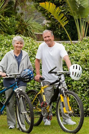 Senior couple mountain biking outside Stock Photo - Budget Royalty-Free & Subscription, Code: 400-05314400