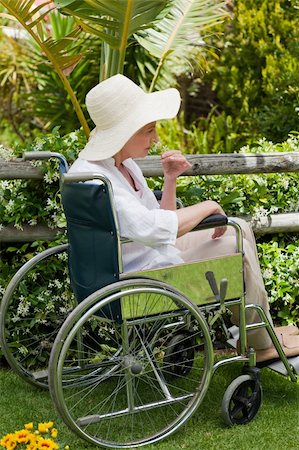 Mature woman in her wheelchair in the garden Stock Photo - Budget Royalty-Free & Subscription, Code: 400-05314662