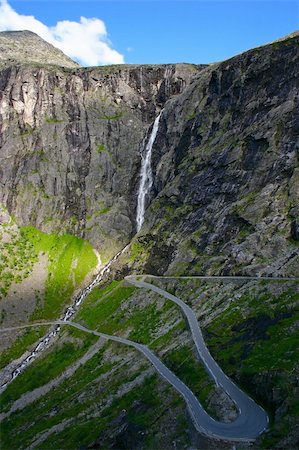 Trollstigen (The Troll Path) is a mountain road in Rauma, Norway. It is a popular tourist attraction due to its steep incline and eleven hairpin bends up a steep mountain side. Stock Photo - Budget Royalty-Free & Subscription, Code: 400-05314676