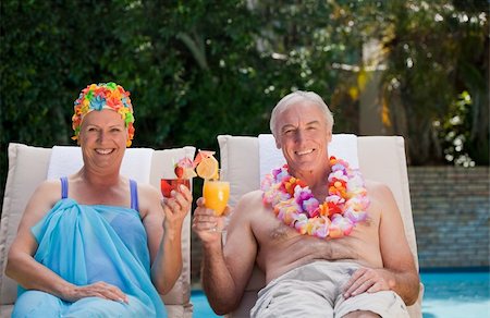 Happy senior couple drinking cocktails and toasting each other Stock Photo - Budget Royalty-Free & Subscription, Code: 400-05314739