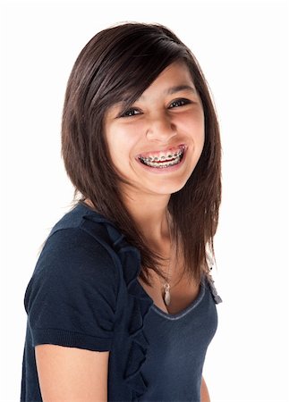 Cute Hispanic teenage girl with braces and a big smile Stock Photo - Budget Royalty-Free & Subscription, Code: 400-05315093